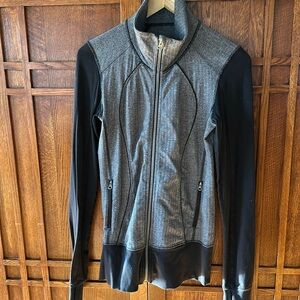 Lululemon zip up. Tag is no longer in the neck line. It is a longer length.